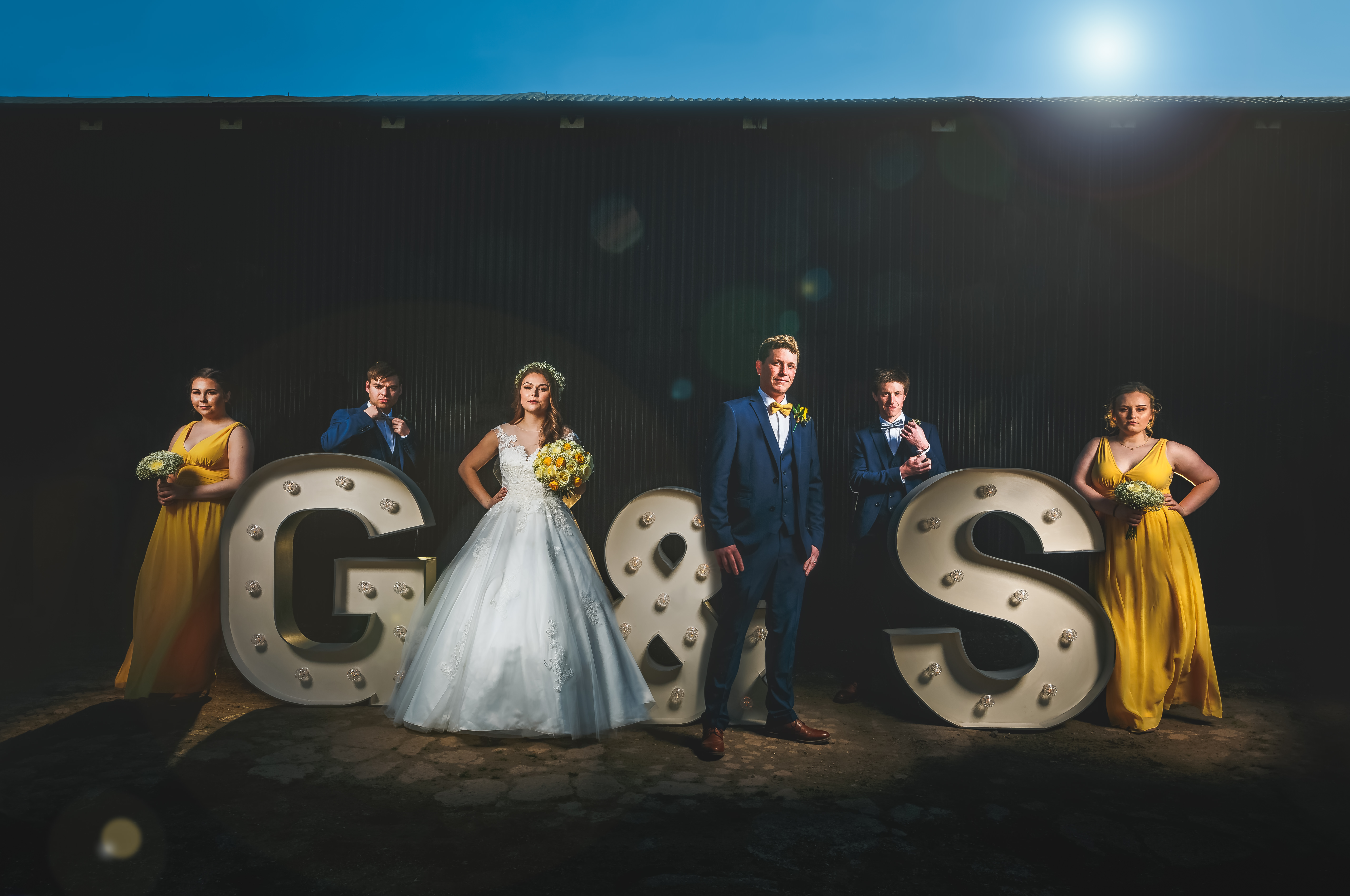 Composite shot using large letters for the bride and groom and their bridesmaids and groomsmen at Park Farmhouse, Castle Donington