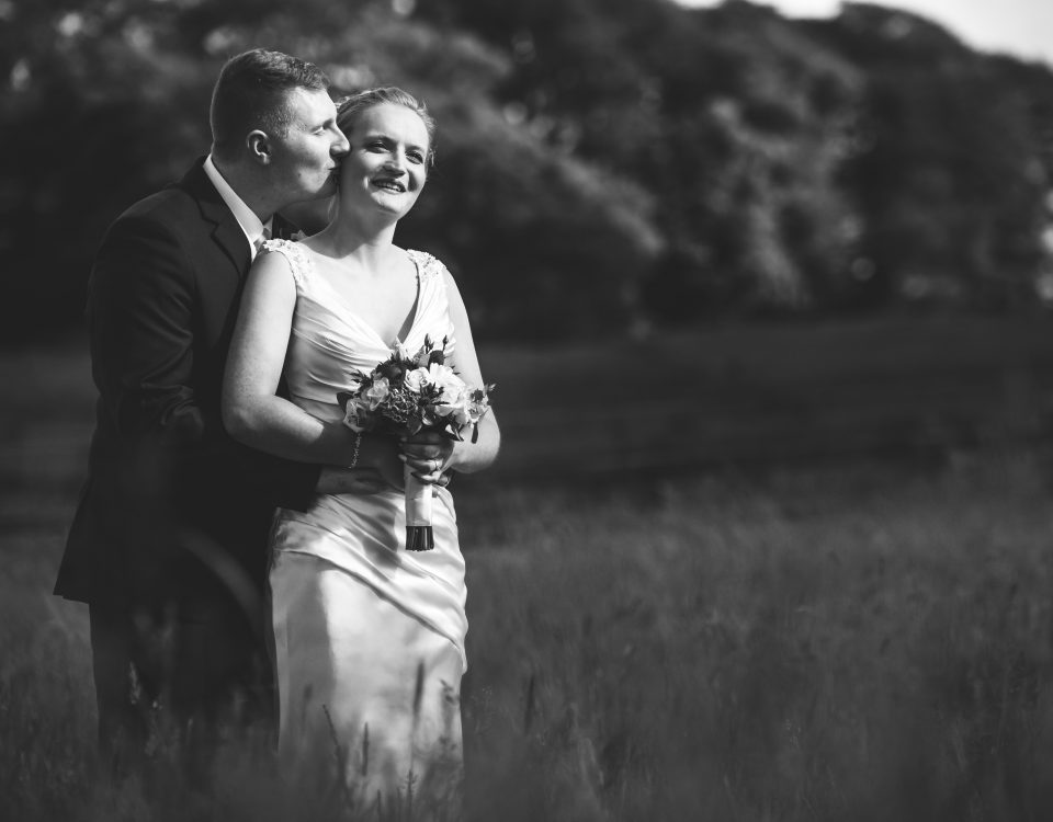 black and white portrait of newlyweds in the open fields surrounding Slaters Country Inn