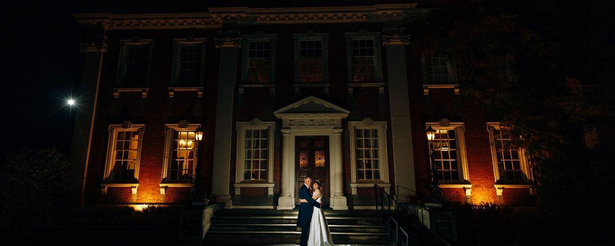 newlyweds outside swinfen hall wedding photography at night time