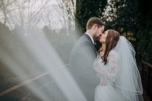 Veil newlyweds outdoor bridge shot branston country club wedding photography